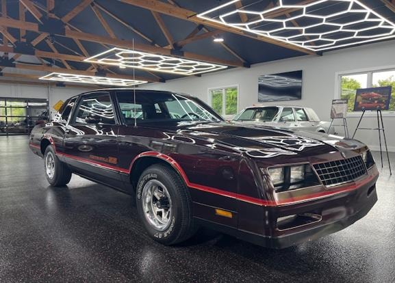 1985 Chevrolet Monte Carlo SS — dark red in showroom